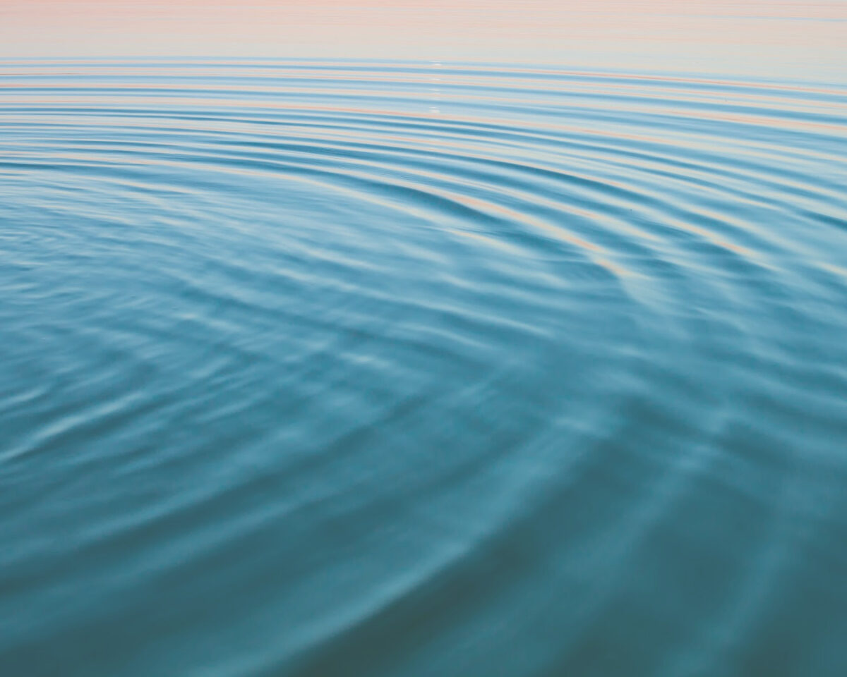 Water ripples illustrating cause and effect without judgment